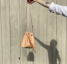 Load image into Gallery viewer, Neon Splatter Veg Tan Leather Drawstring Crossbody Bucket Bag
